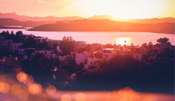 Sunset landscape in mountain range overlooking a lake
